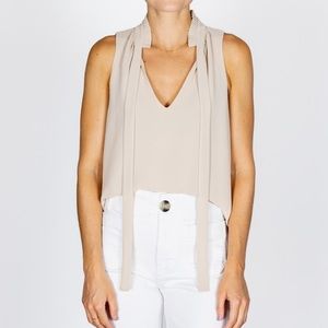 Medium cream color v-neck sleeveless blouse
